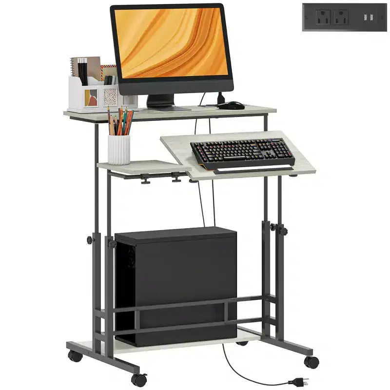 HOMCOM Standing Desk with Power Outlets Height Adjustable Stand Up Desk with Tiltable Tabletop Lockable Wheels Shelf for Home Office