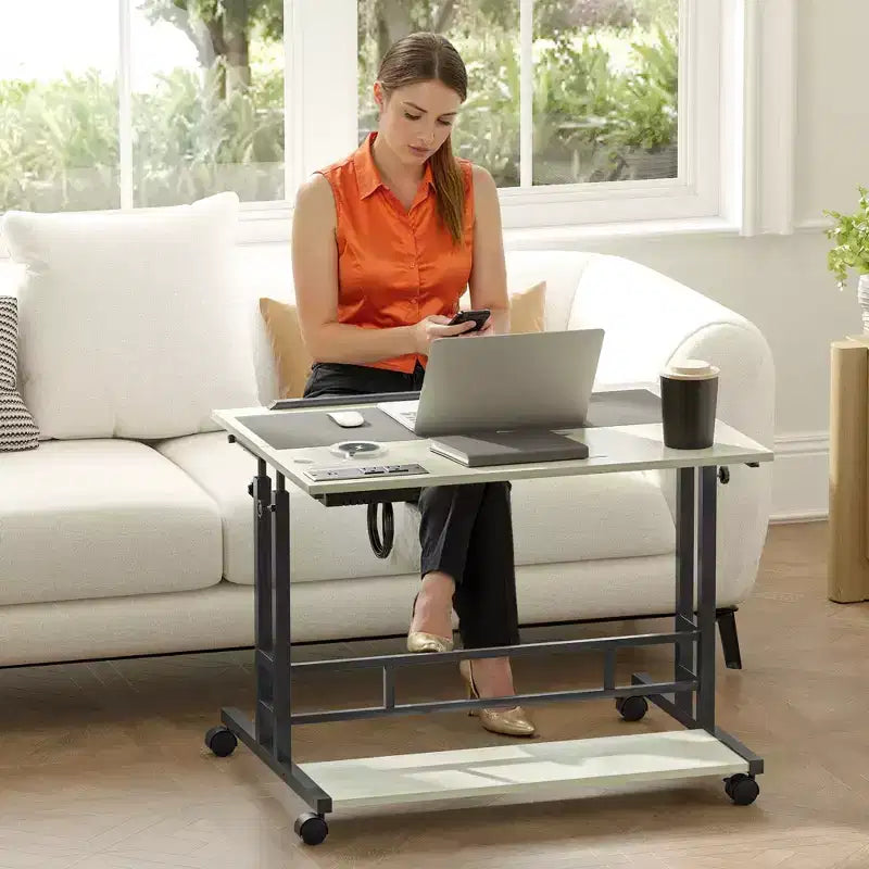 HOMCOM Standing Desk with Power Outlets Height Adjustable Stand Up Desk with Tiltable Tabletop Lockable Wheels Shelf for Home Office